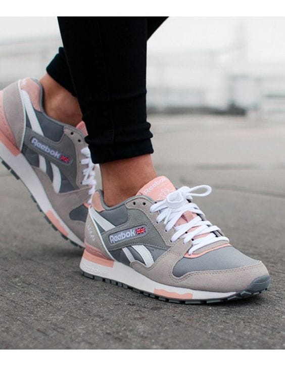 Gray, pink, and white sneakers made of breathable mesh and durable suede. Low-top design ideal for casual outfits and active lifestyles.