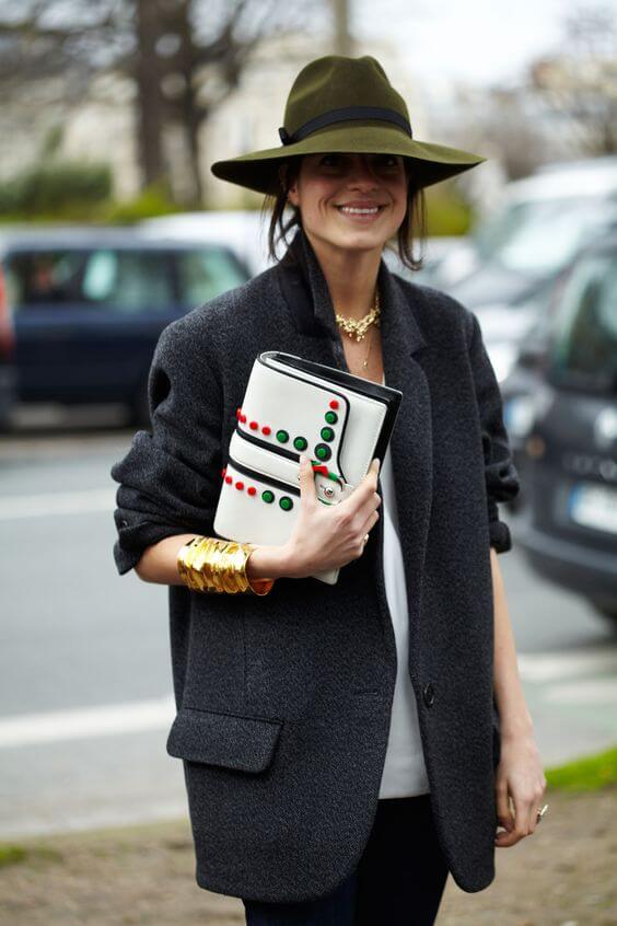 Wide-brim olive green women's winter hat paired with a dark gray oversized blazer, perfect for casual outings in mild climates.