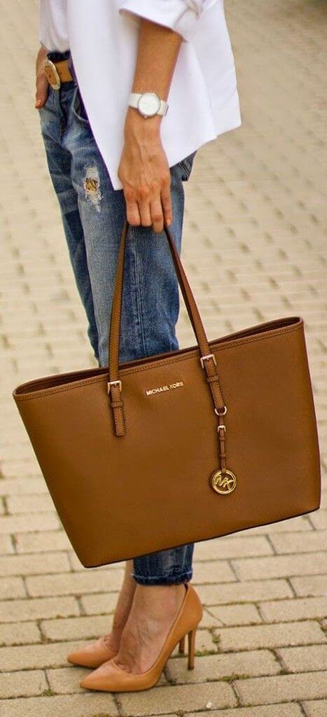 Rich brown leather handbag, structured rectangular design (15x10 inches), dual top handles, removable charm. Perfect for chic outfits.