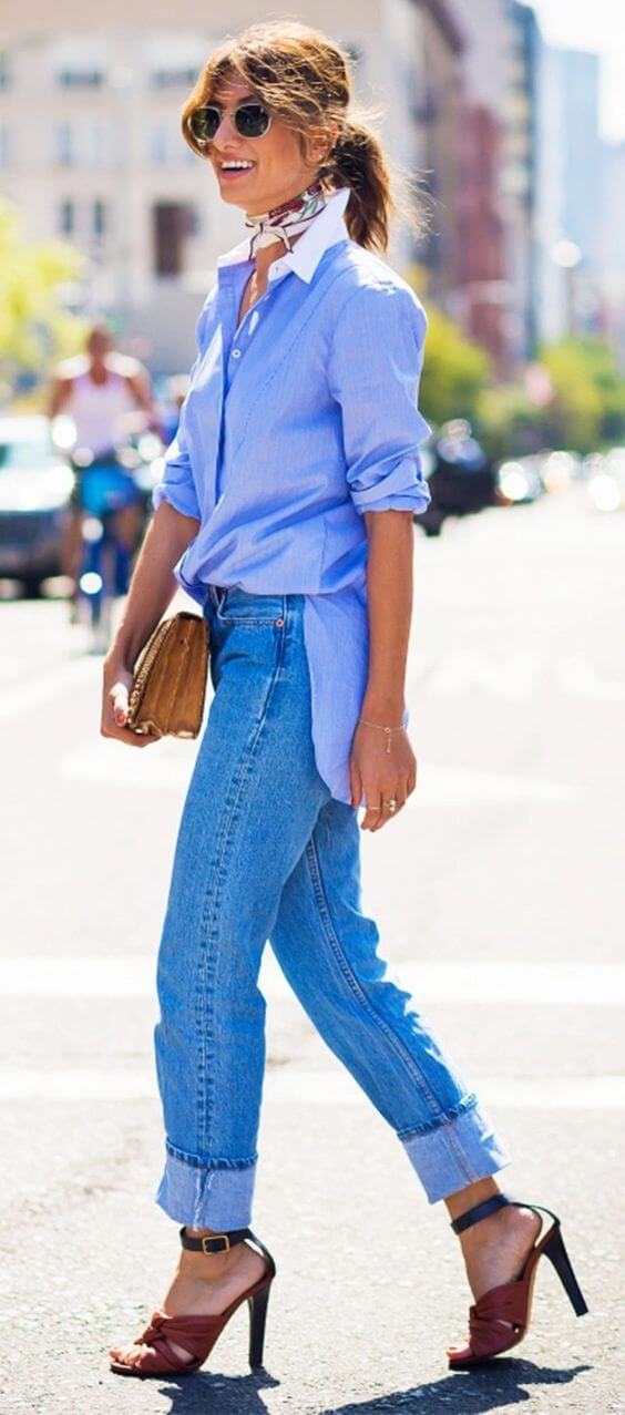 Casual chic hairstyle with loose, wavy layers, complemented by a stylish neck scarf and sunglasses, perfect for summer outings.