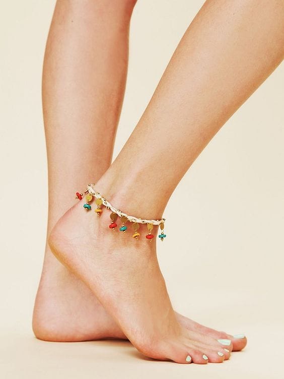 Colorful boho anklet featuring a lightweight chain with vibrant charms in red, yellow, and green, perfect for summer outfits.