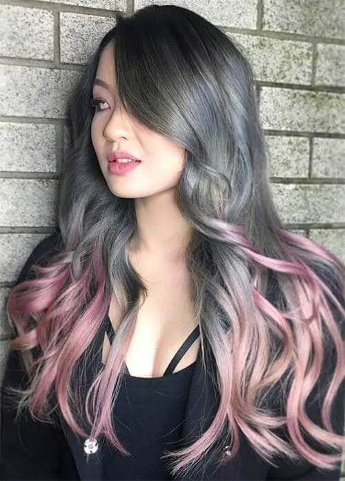 Cool gray and pastel pink ombre with layered cut for chic, contemporary style.