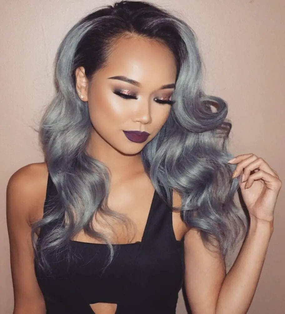 Luxurious silvery-blue gray waves with side part for a glamorous, sophisticated look.