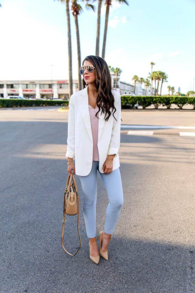 Chic pastel outfit featuring a tailored white blazer, light pink top, and pastel blue trousers, ideal for spring soft aesthetics.