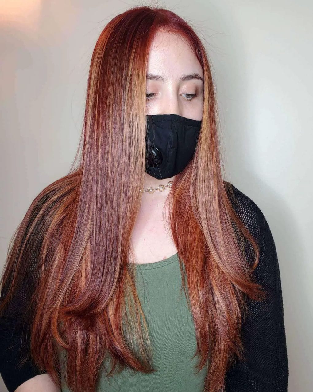 Straight layers with a seamless transition from blonde to red hues.
