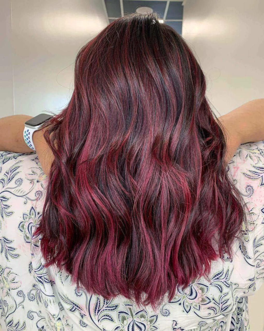 Rich red balayage on mid-back length hair, bold gradient.