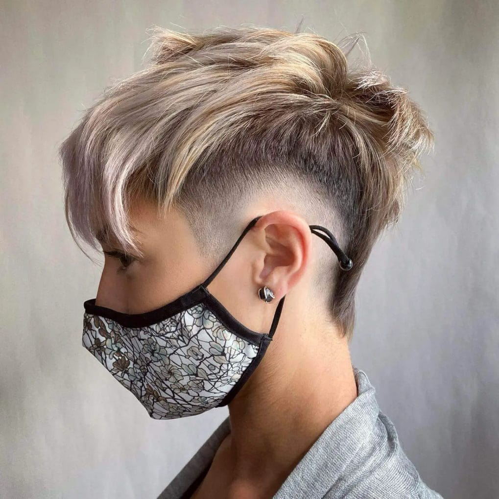 Mullet-inspired pixie with fade undercut and ash tones.