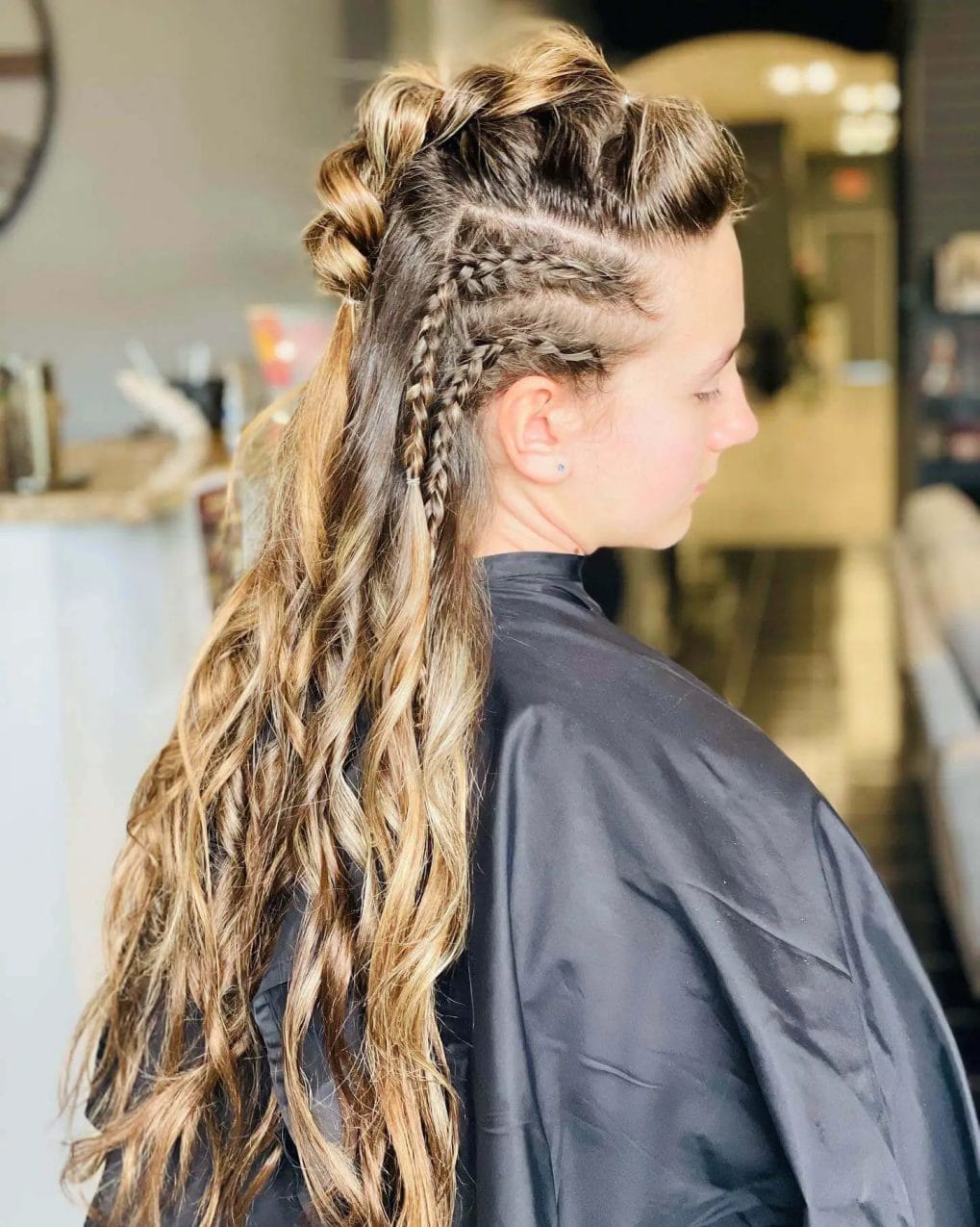 Deep brown and blonde Viking braids contrasted with loose waves.