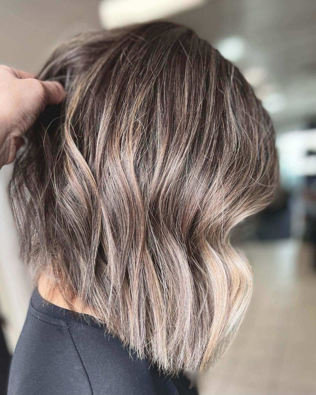 A-line bob, longer front, silver-ash balayage.