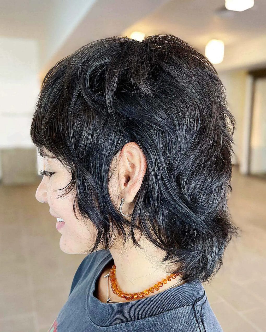Mullet-shag hybrid with textured layers and a tousled finish.