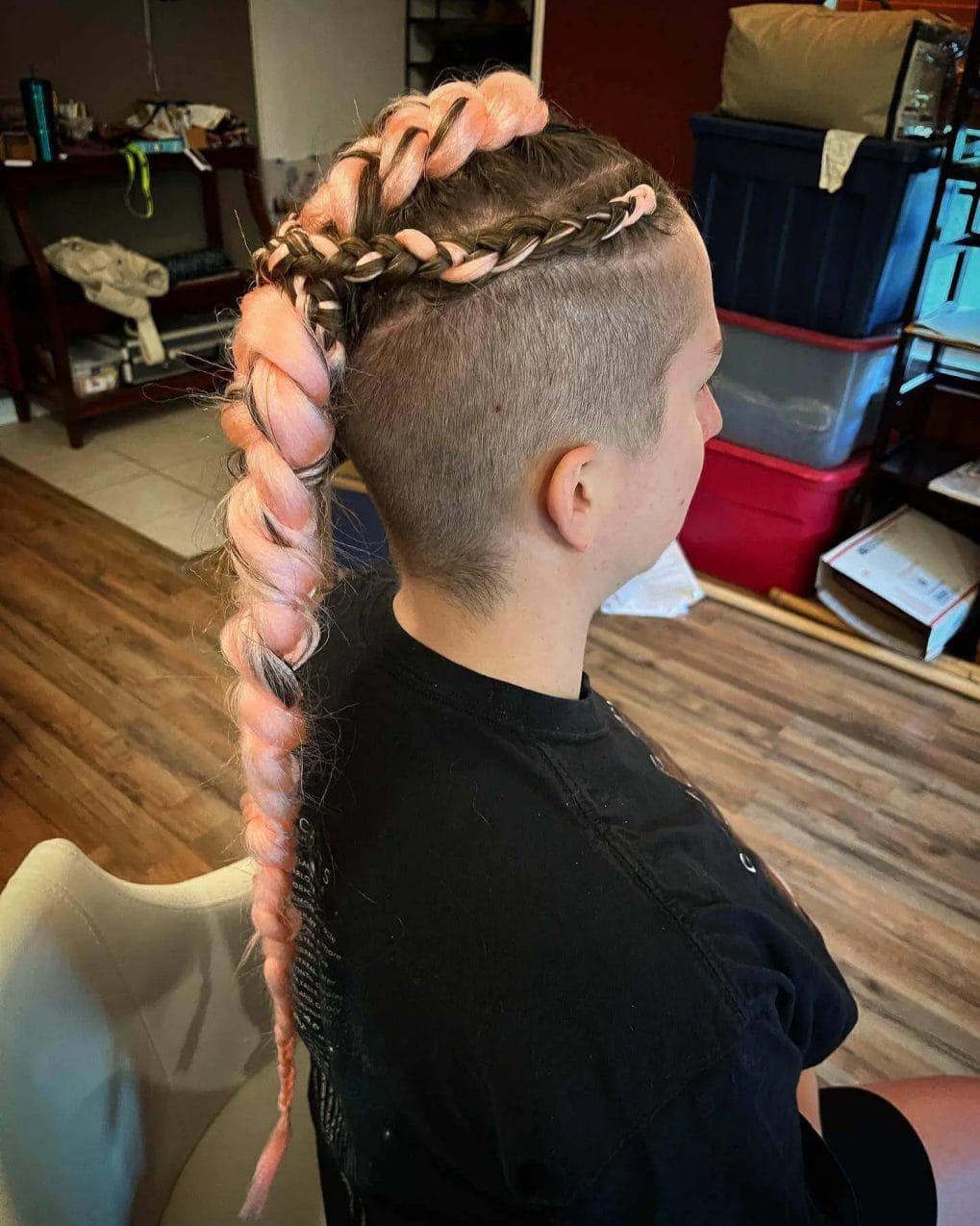 Pastel pink Viking braid with a shaved side.