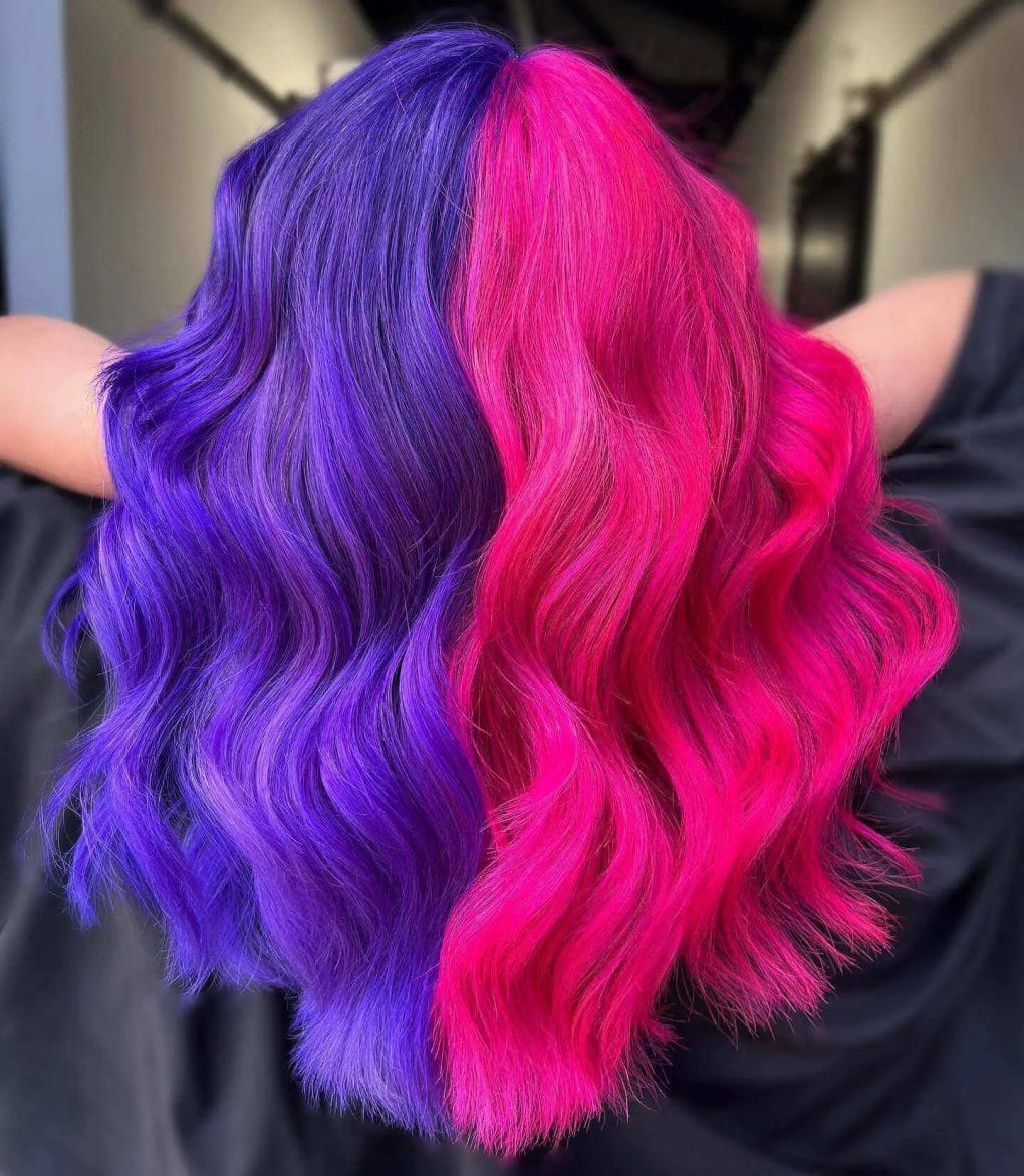 Electric pink and deep royal purple split dye with voluminous waves.