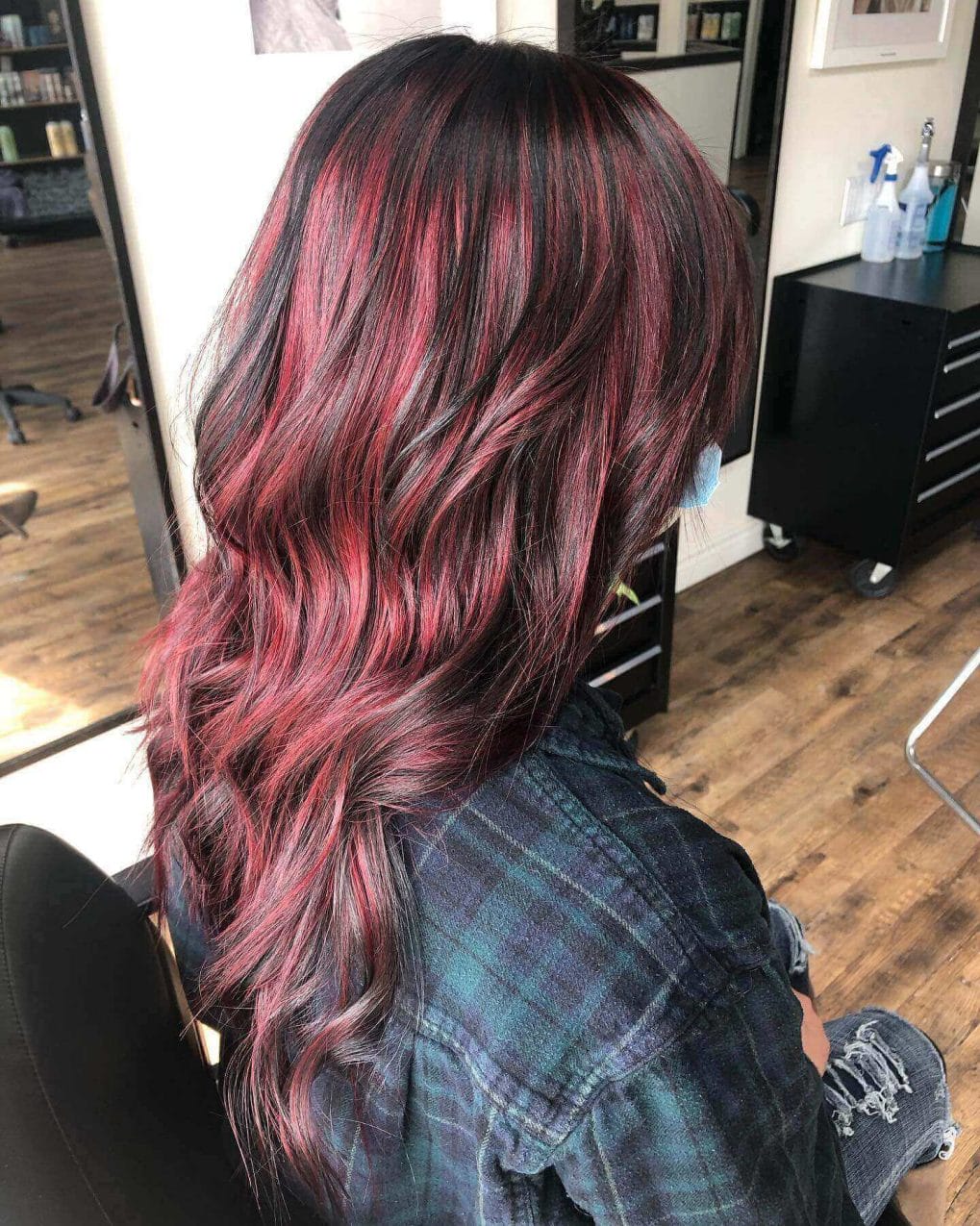 Red and brunette balayage in flowing, elegant long layers.