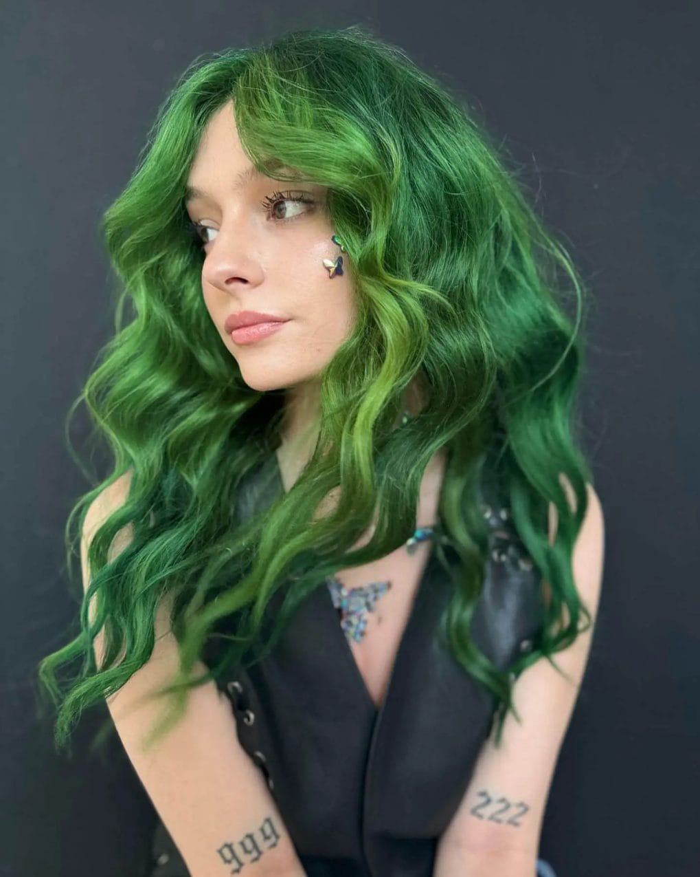 Lush emerald green cascade with romantic natural curls.