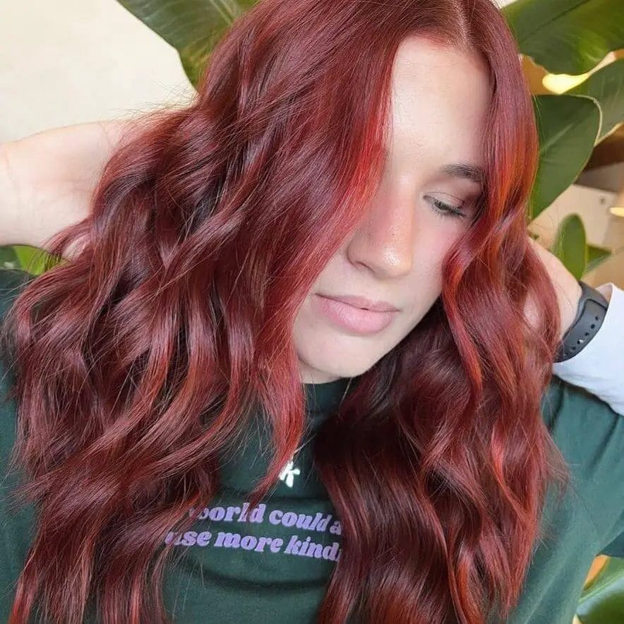 Fiery red balayage on gracefully tumbling waves.