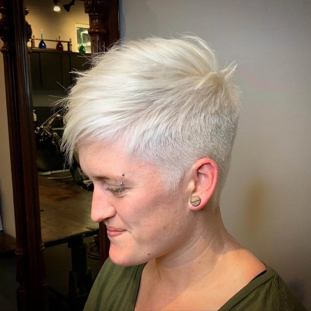 Cool icy blonde pixie with sharp undercut.