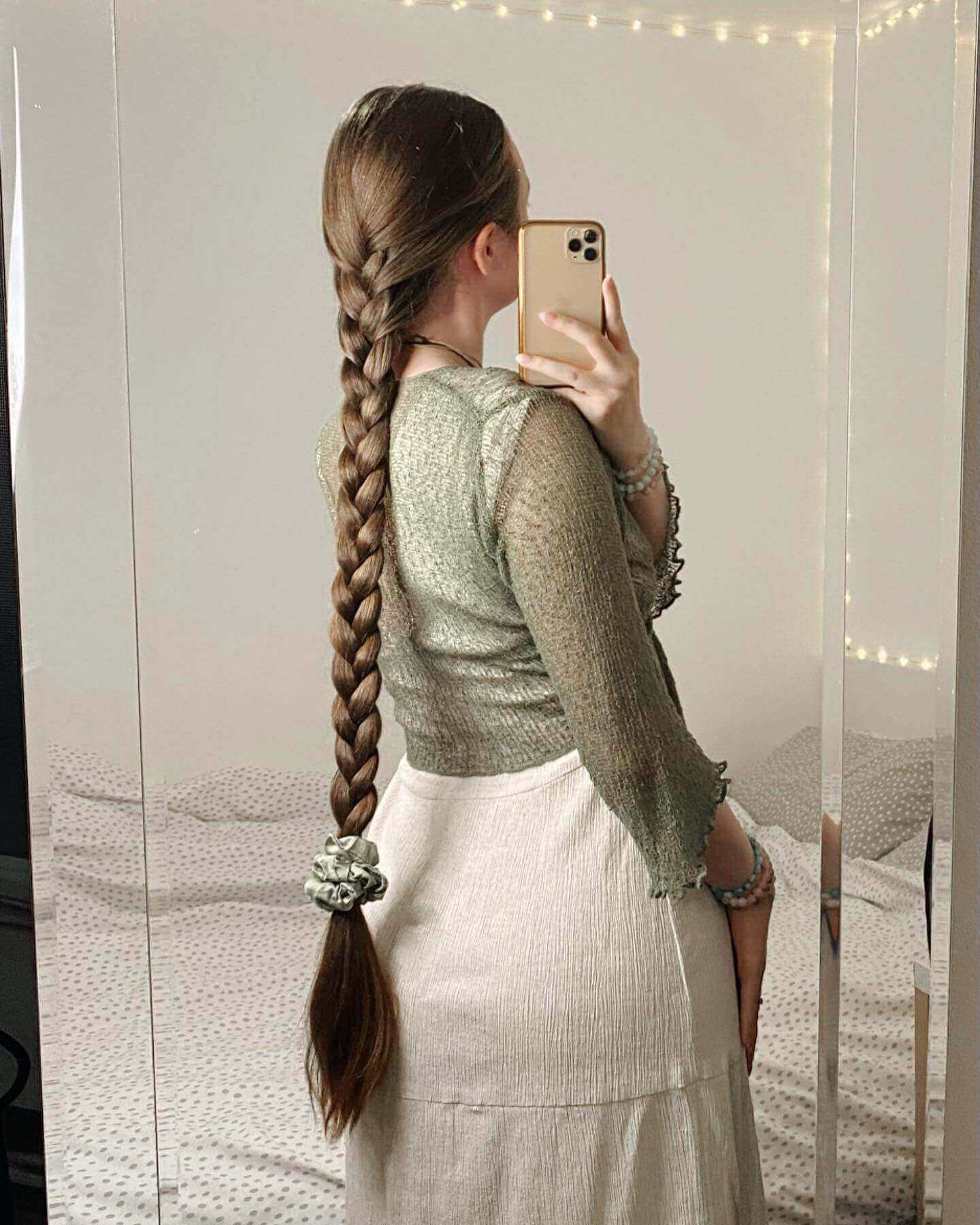 Intricate French braid starting at the nape with ombre brunette to caramel tones.