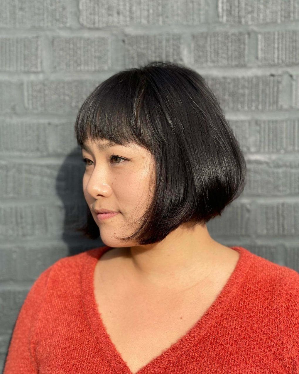 Jet-black chin-length Italian bob.