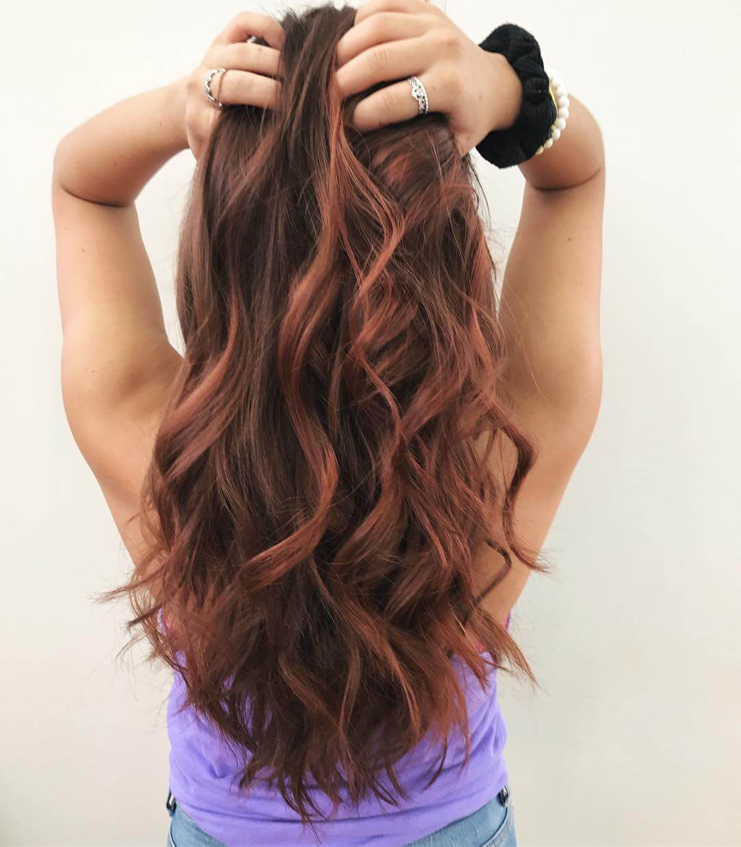 Long brunette and red balayage, sunset colors, subtle layers.