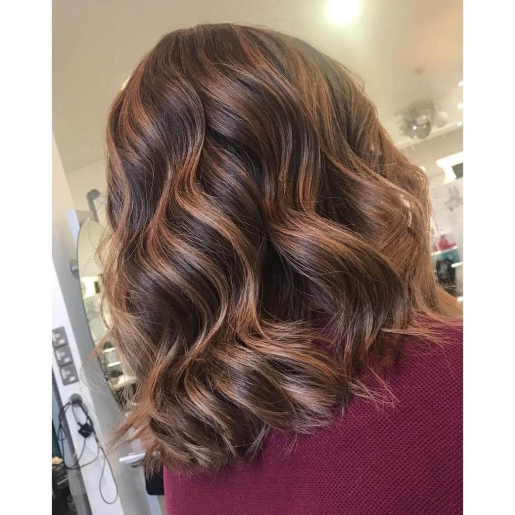 Layered waves with warm brown tones.