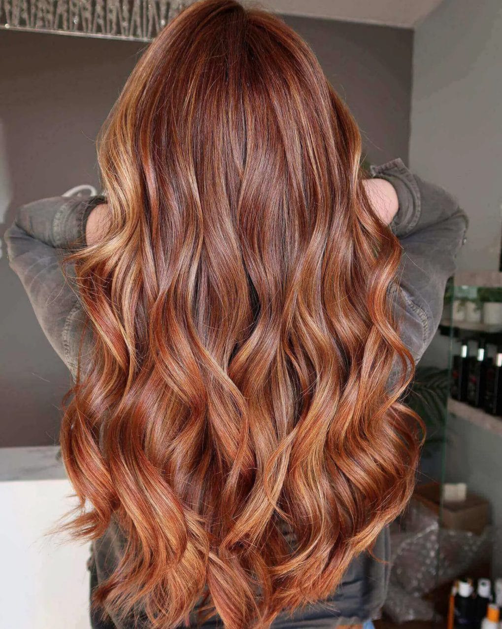 Mahogany waves with copper balayage and luxurious layers.