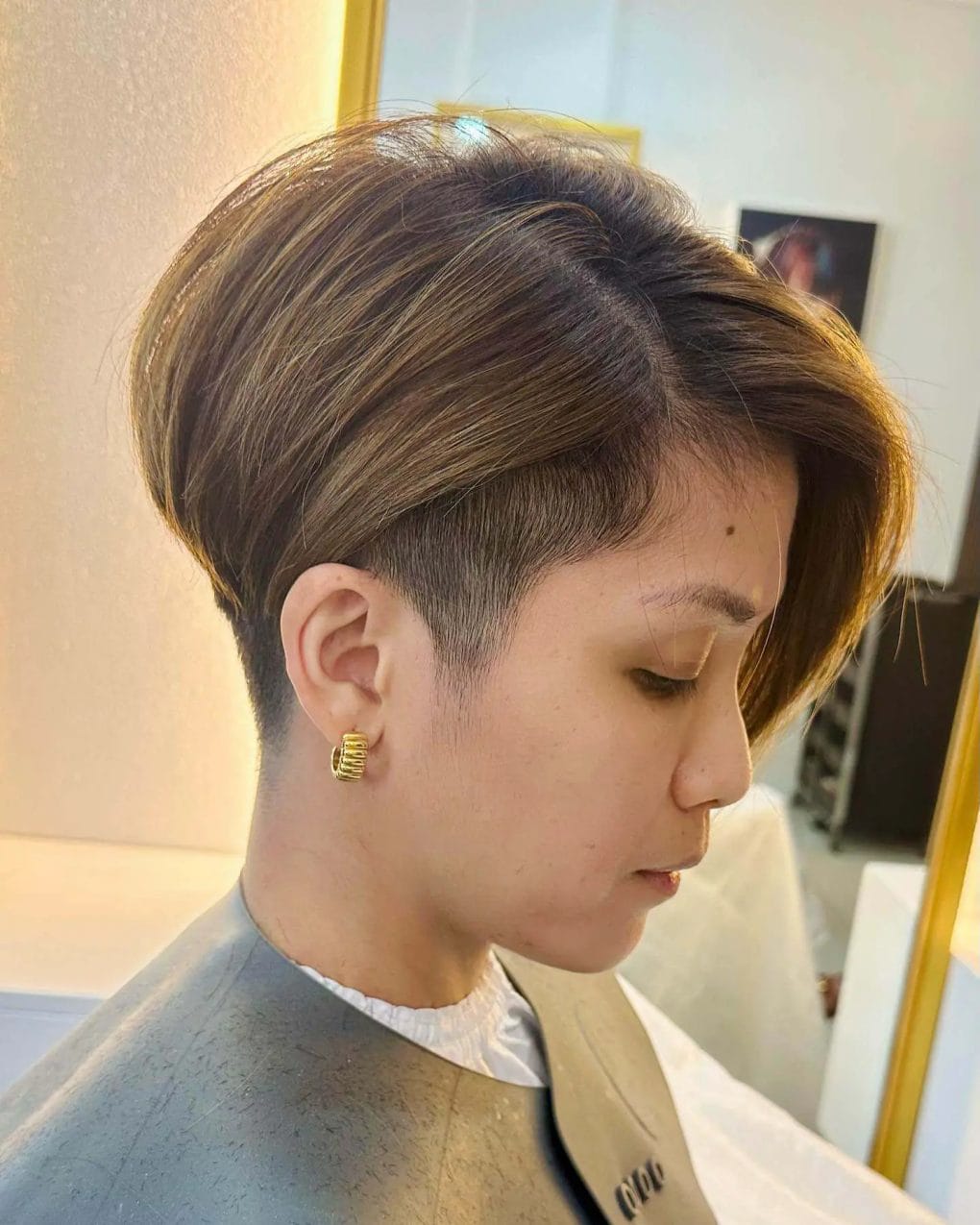Chic brown pixie with highlights and soft side fringe.