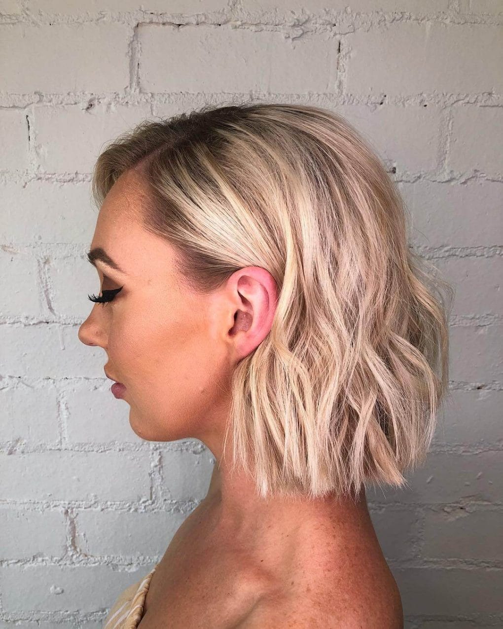 Tousled bob with multi-tonal blonde shades.