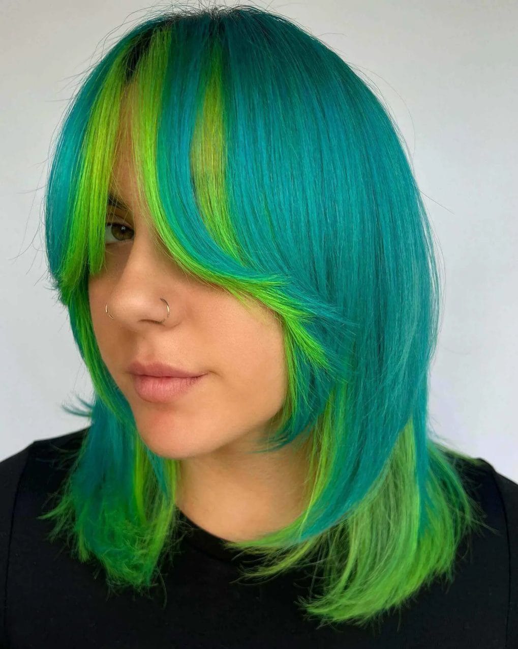 Dynamic vertigo neon blue and adrenaline neon green shoulder-length blend.