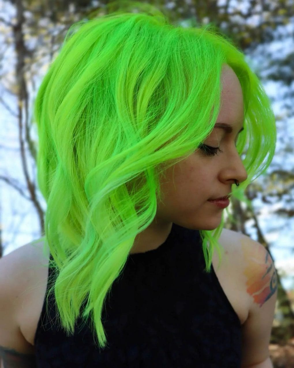 Electric neon green in a tousled mid-length cut.