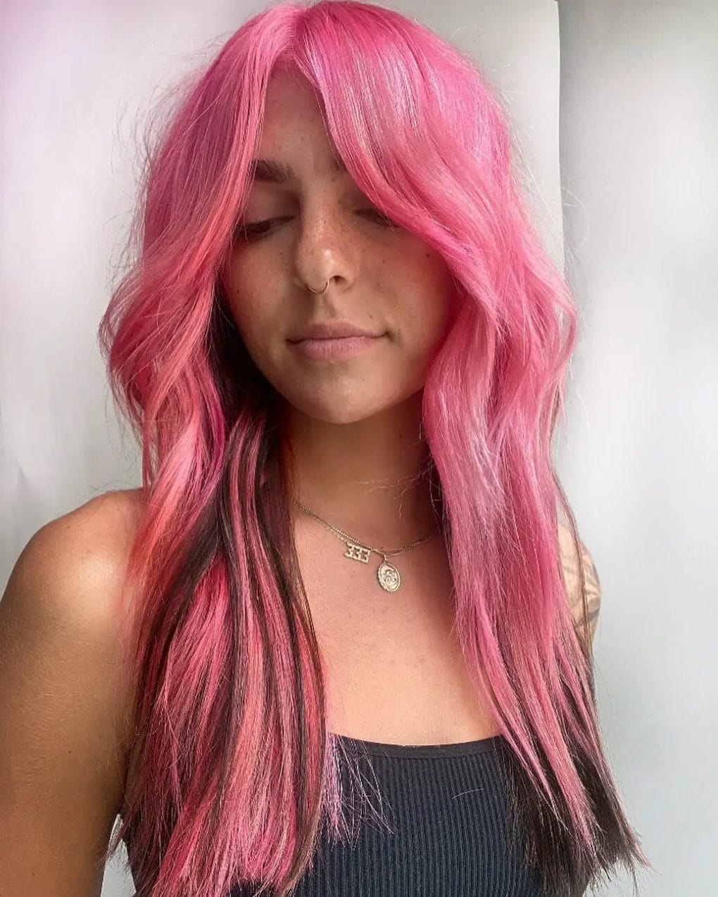 Vivid pink cotton candy dream with dark tips in long waves.