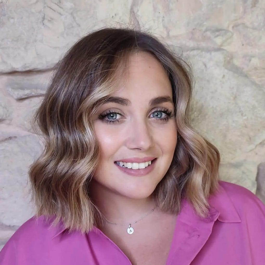 Wavy blonde bob with subtle layers.