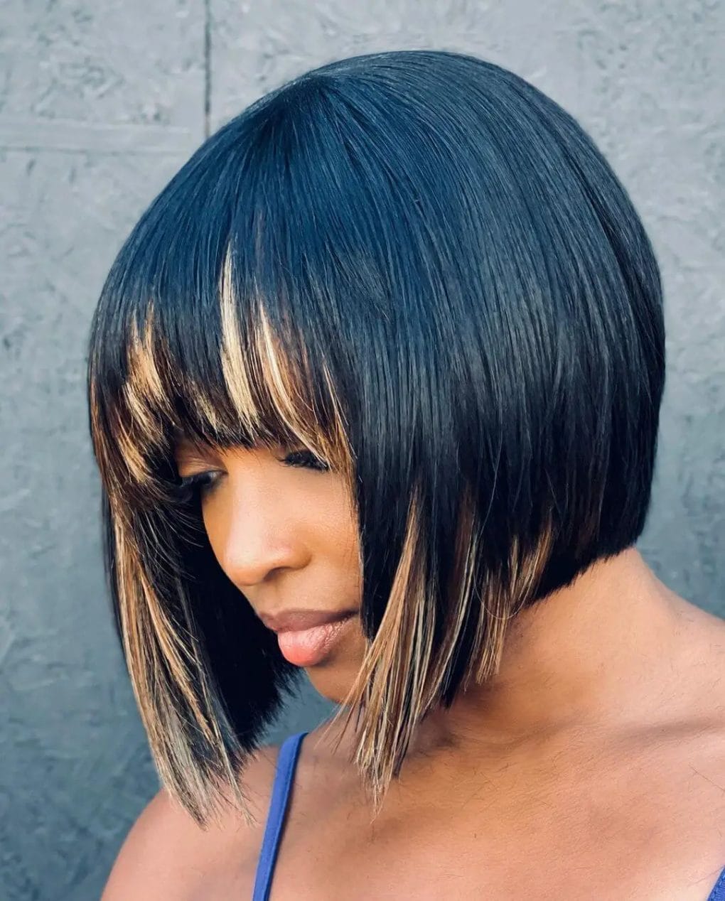 Precision-cut bob with black and blonde highlights.