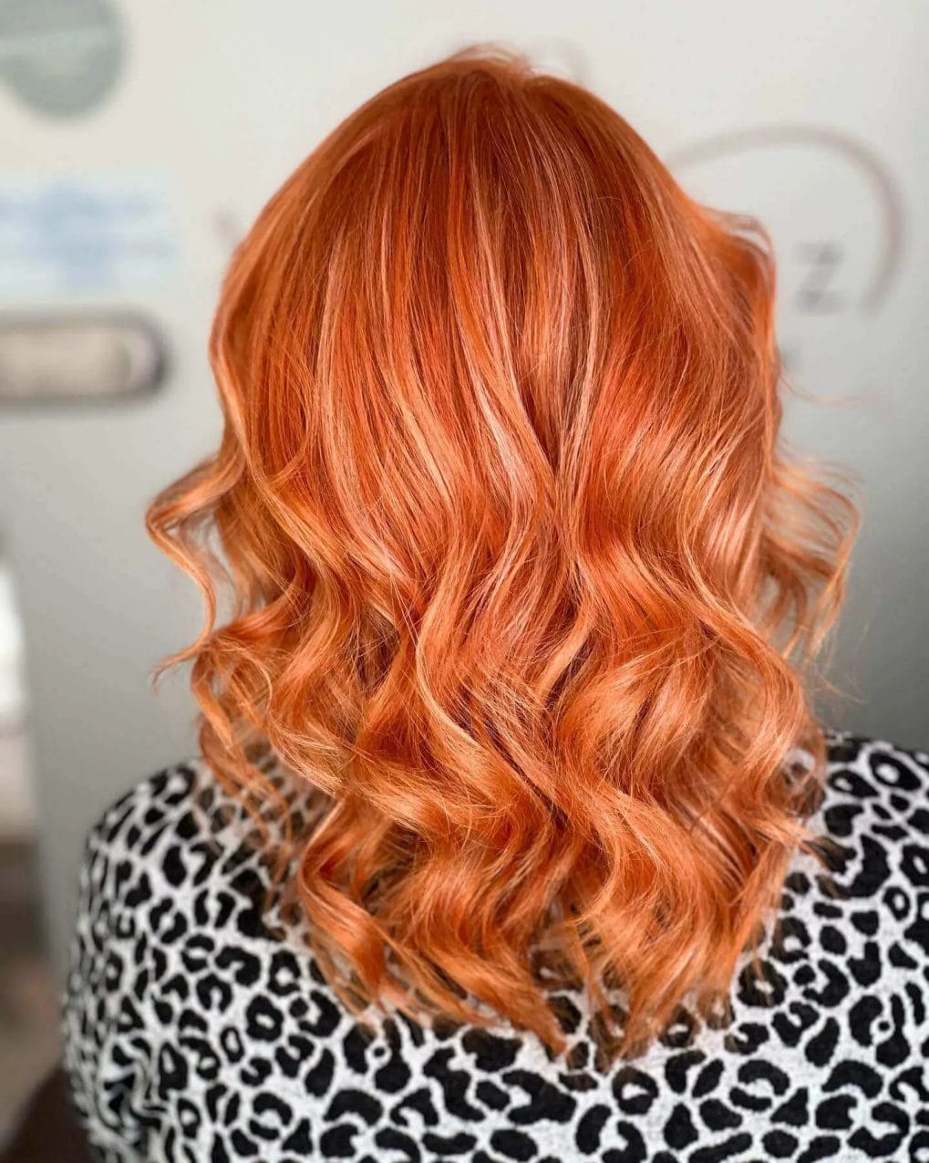 Long layers with fiery reds and oranges in playful waves.