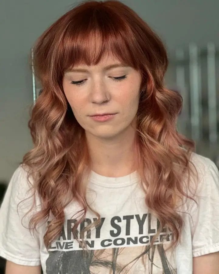 Rosewood to soft pink ombre with full fringe and medium layers.