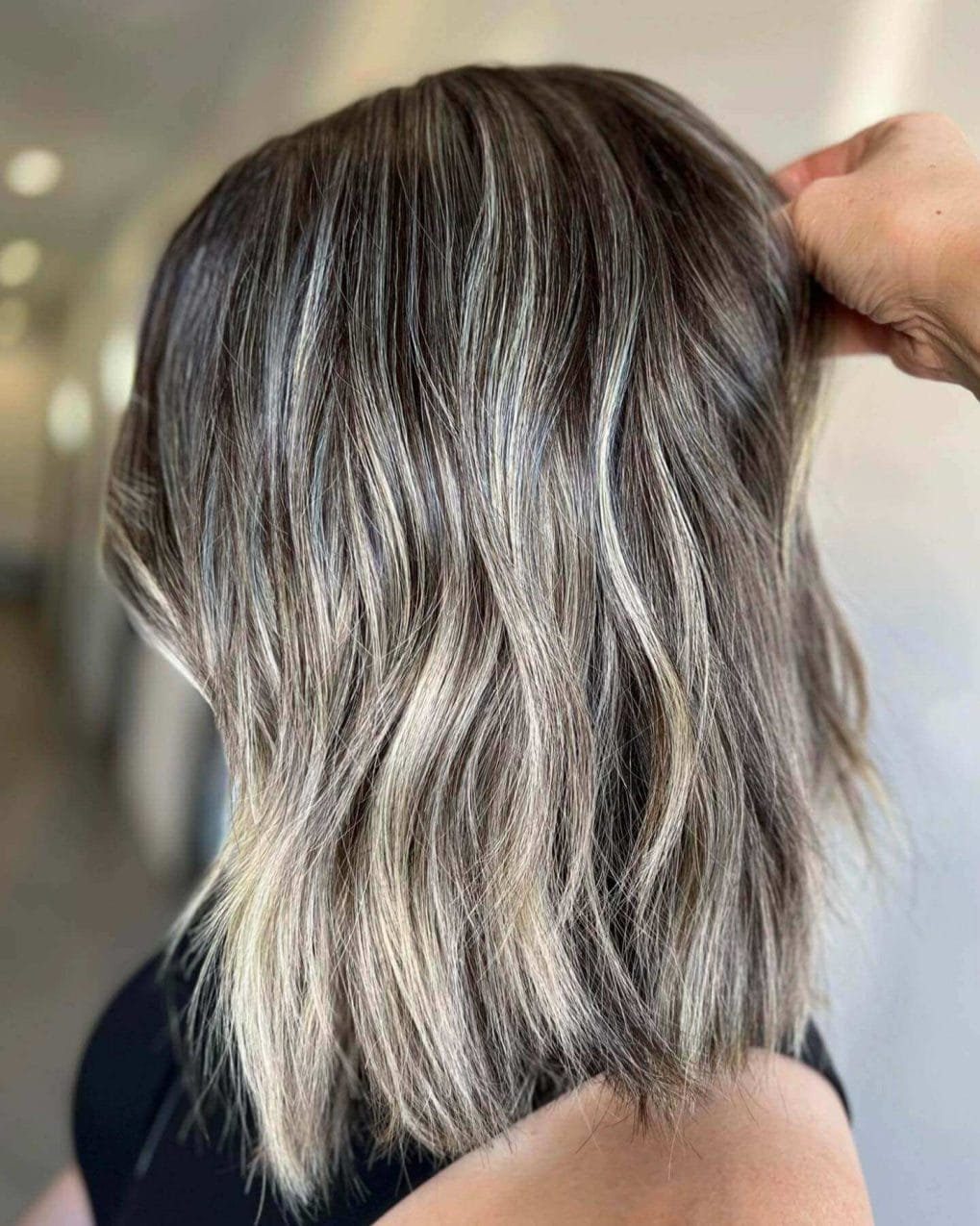 Sleek bob, cool-toned balayage highlights.