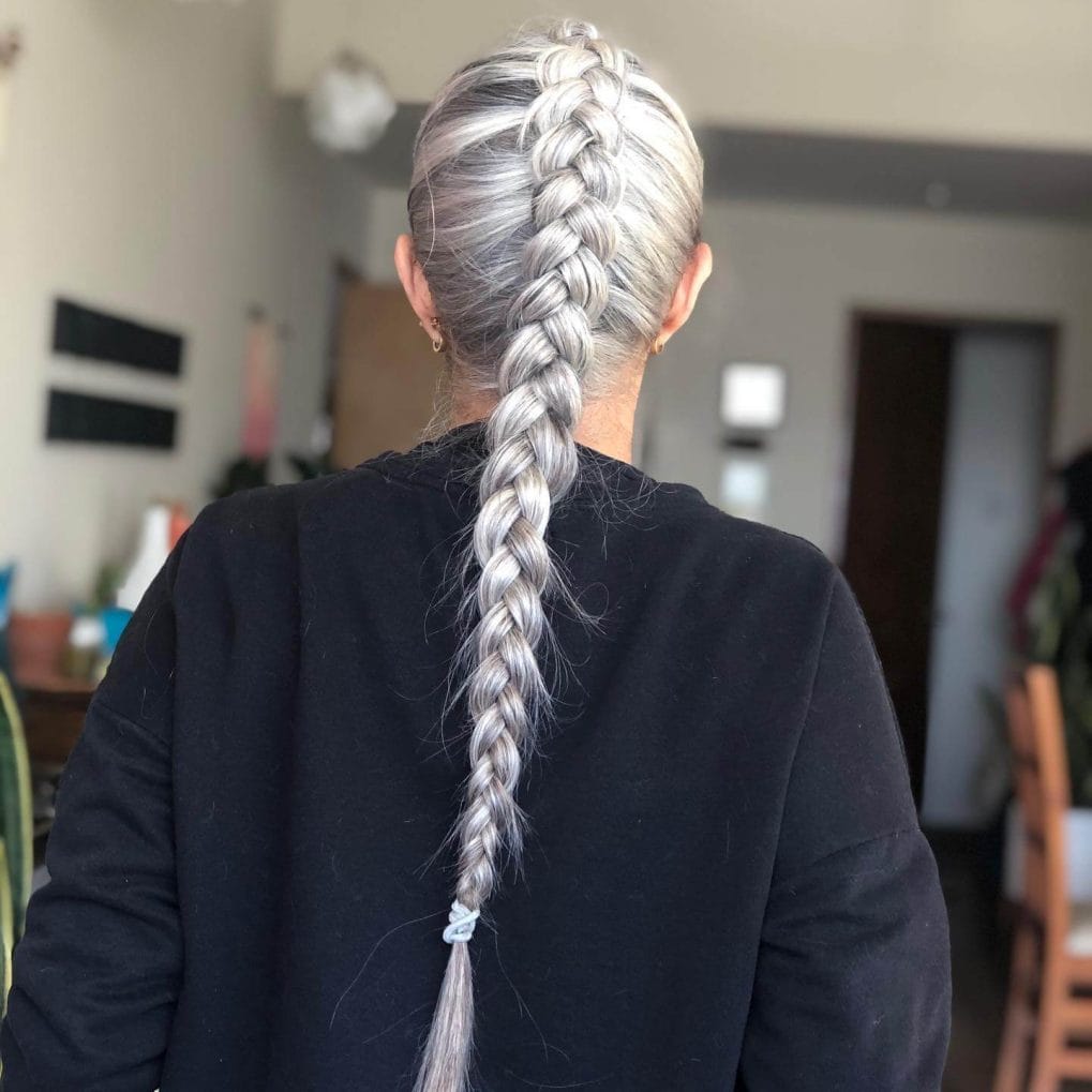 Sleek crown-to-back French braid in striking silver hue.