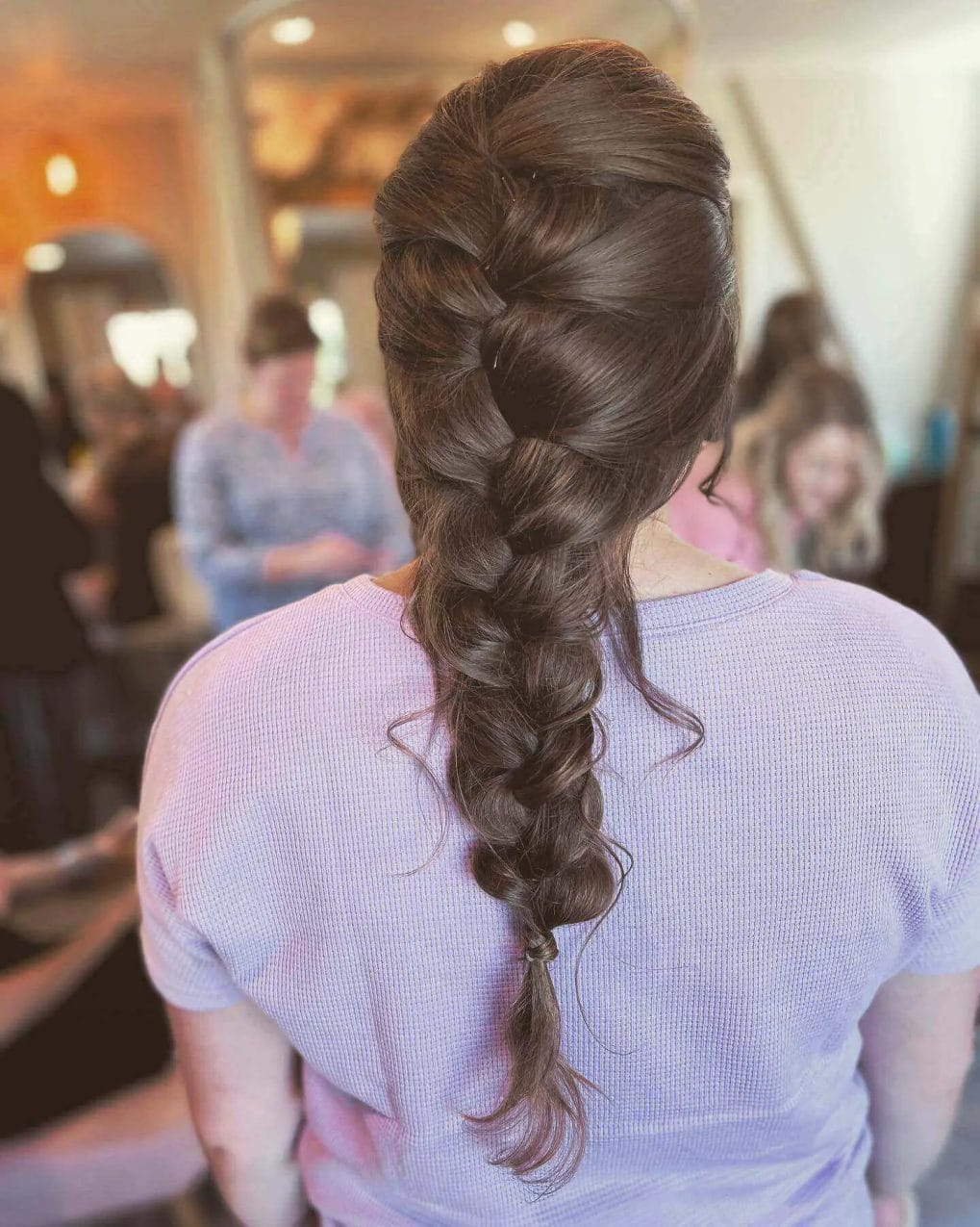 Smooth flowing French braid in glossy chestnut, starting above the ears.