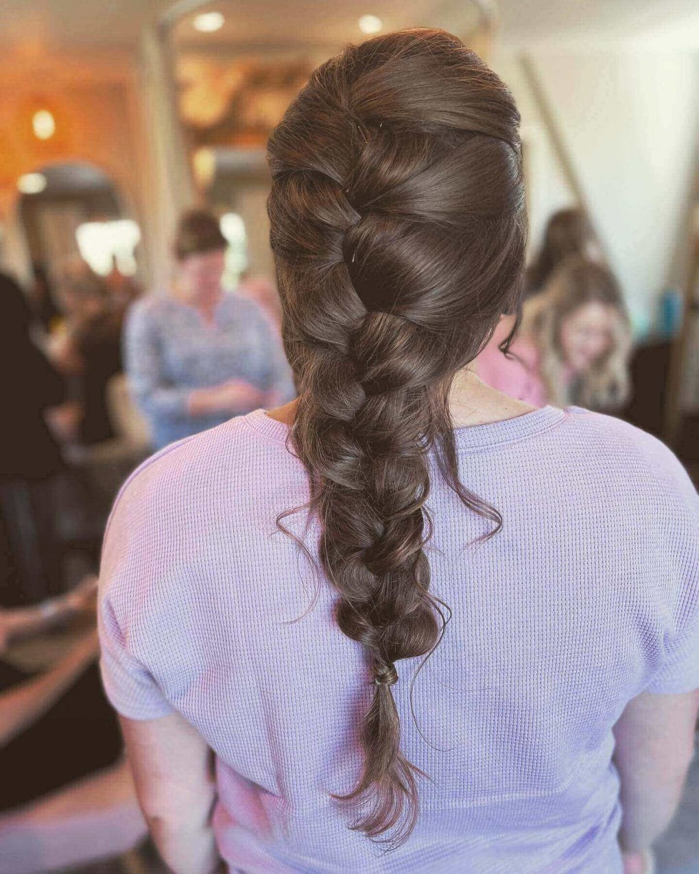 Smooth flowing French braid in glossy chestnut, starting above the ears.