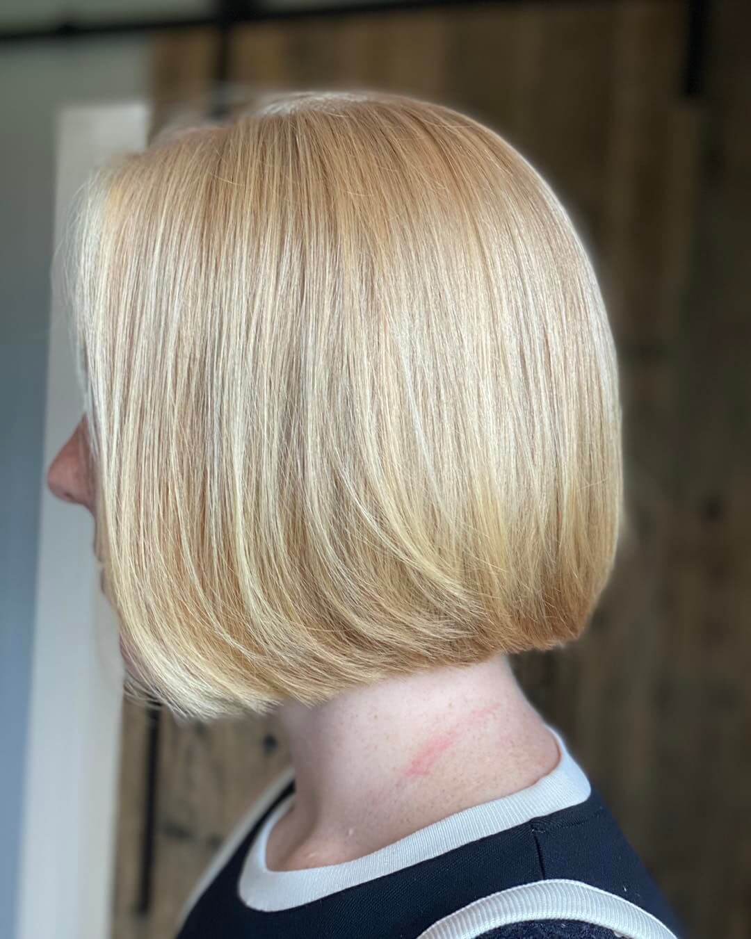 Smooth creamy blonde Italian bob.