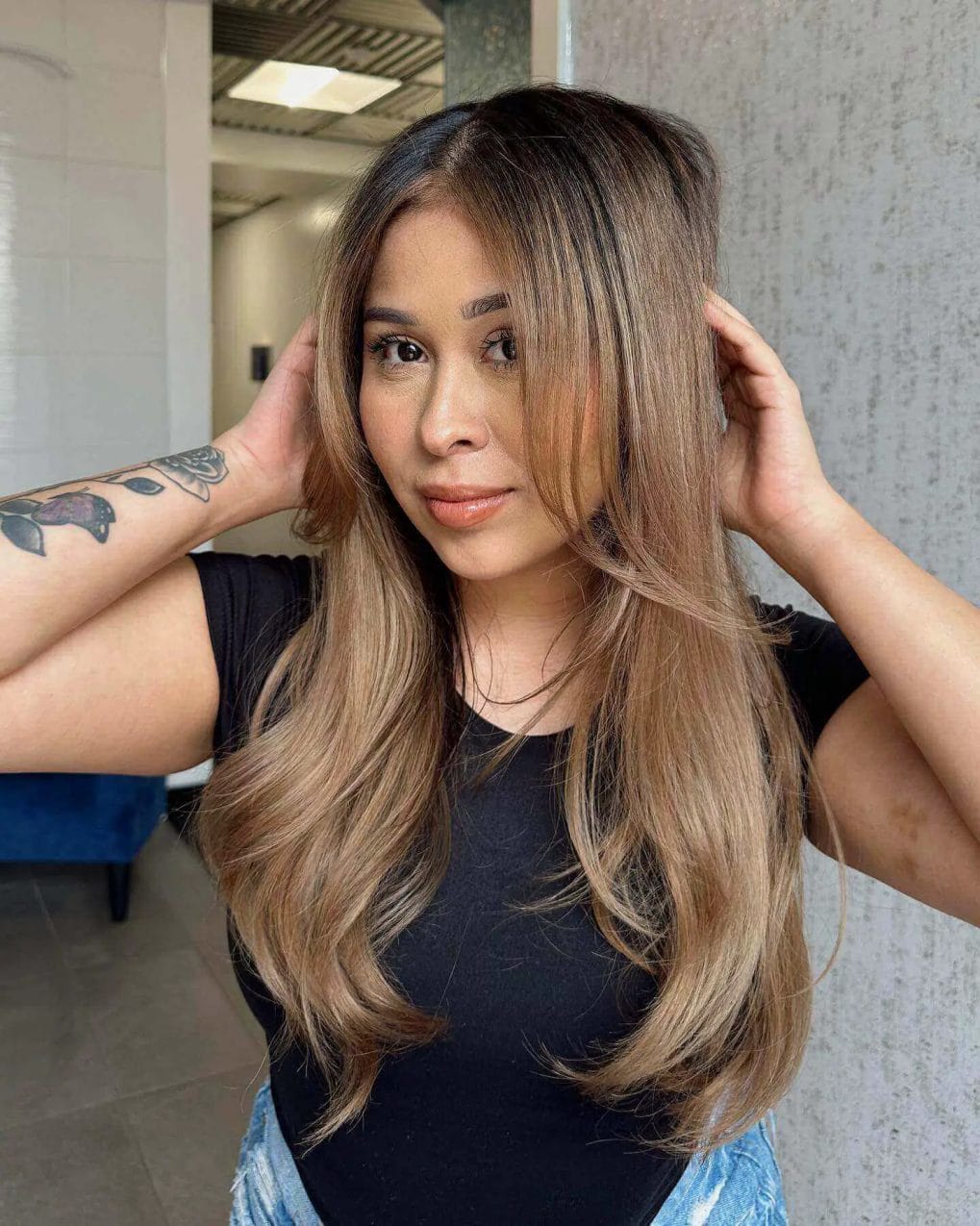 Sophisticated 'bronde' balayage with ash and honey tones, flowing layers.