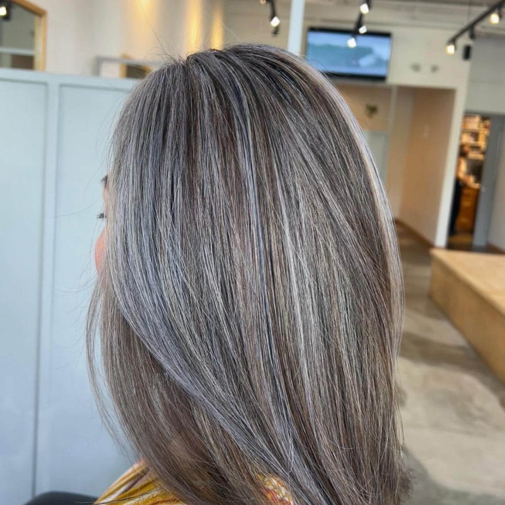 Sleek, straight balayage with multidimensional gray highlights and lowlights.