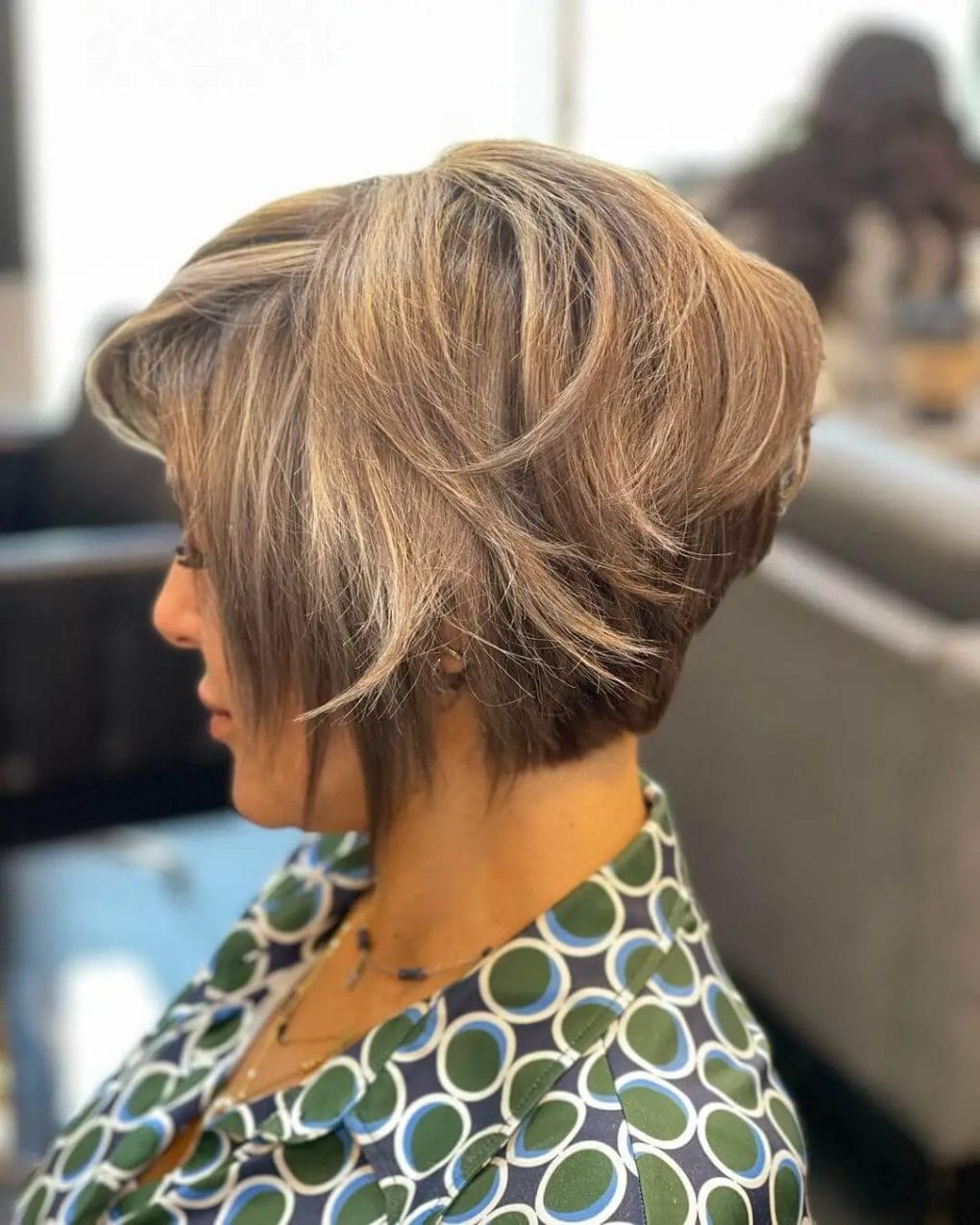 Ash blonde and brown textured pixie with youthful volume.