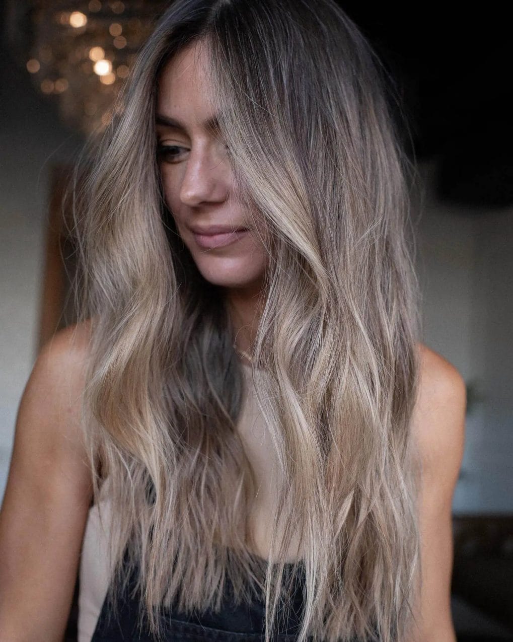 Textured, beachy layers in sun-kissed blonde and natural gray.
