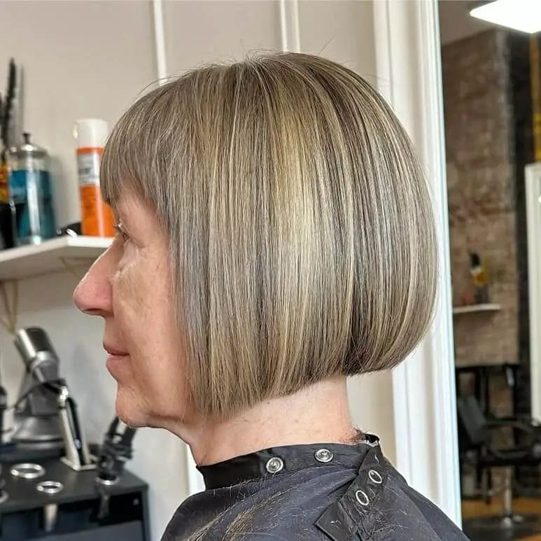 Classic chin-length bob with sleek edges and ash blonde highlights.