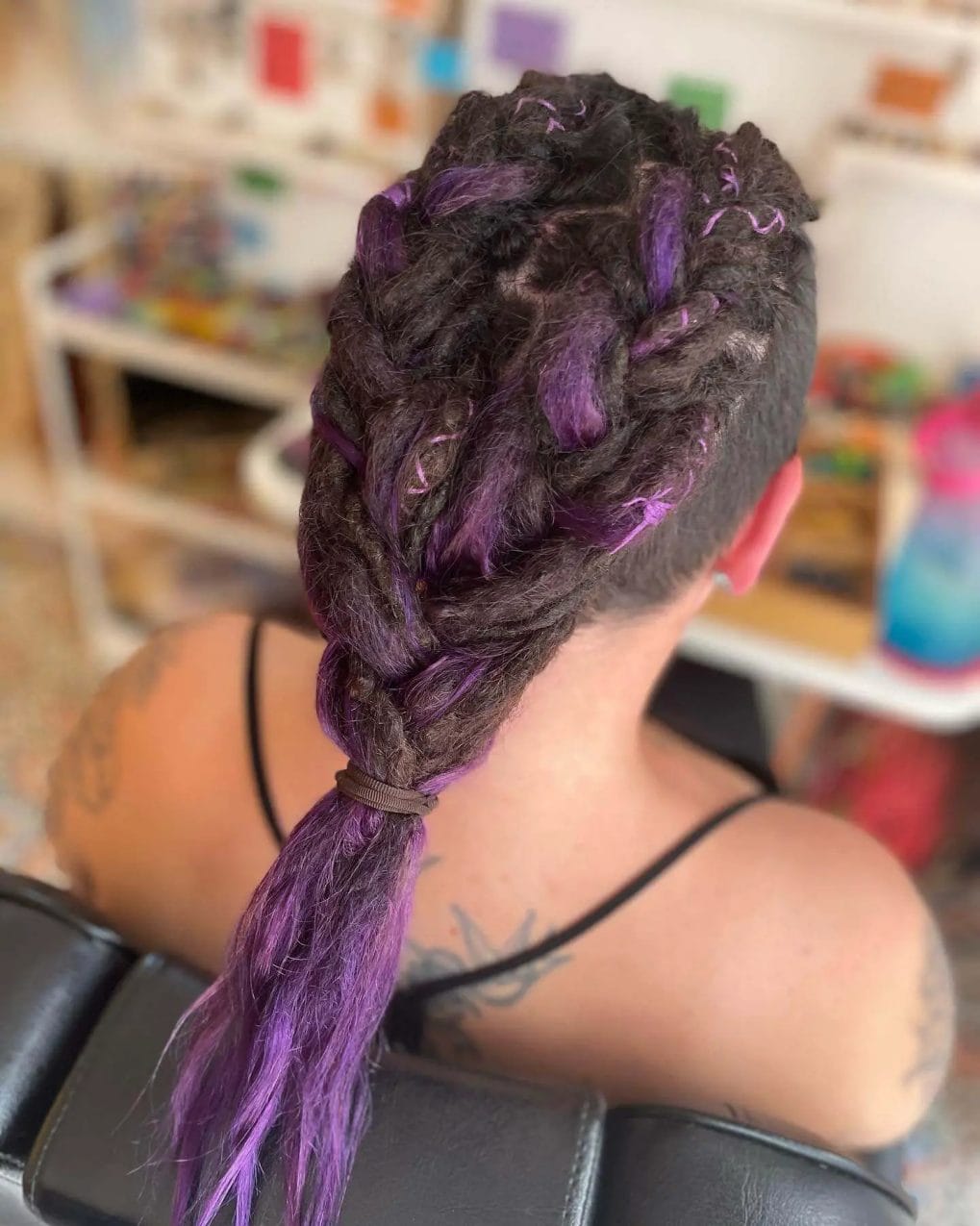 Black and purple Viking-inspired dreadlocks and braids.