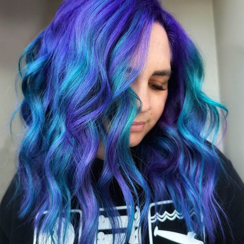 Deep violet roots flowing into azure and teal mermaid waves.