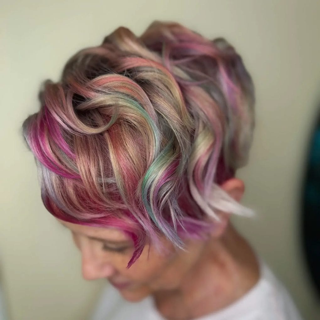Multi-tonal pixie with playful pink, purple, and blonde curls