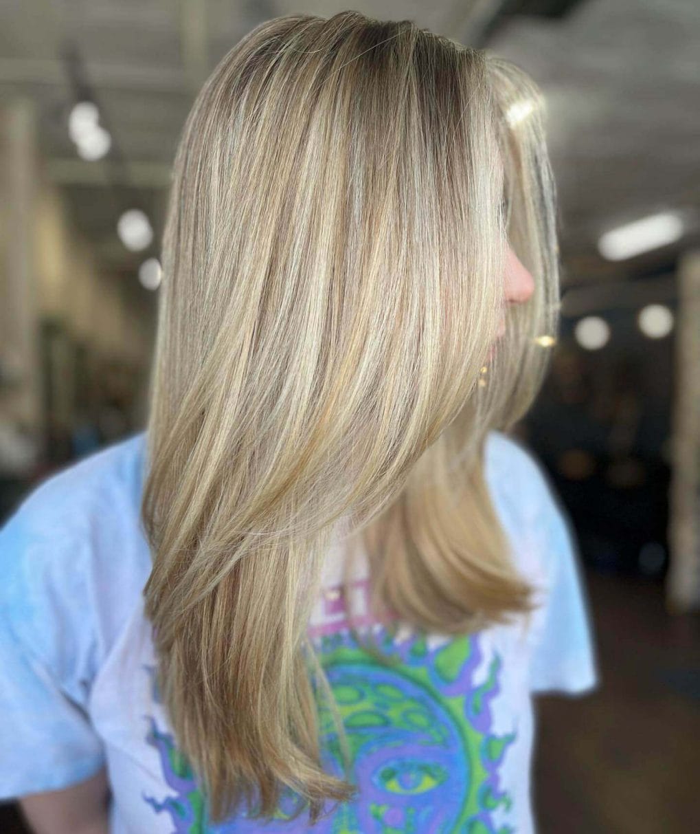 Long straight hair with subtle layers and blonde highlights for school