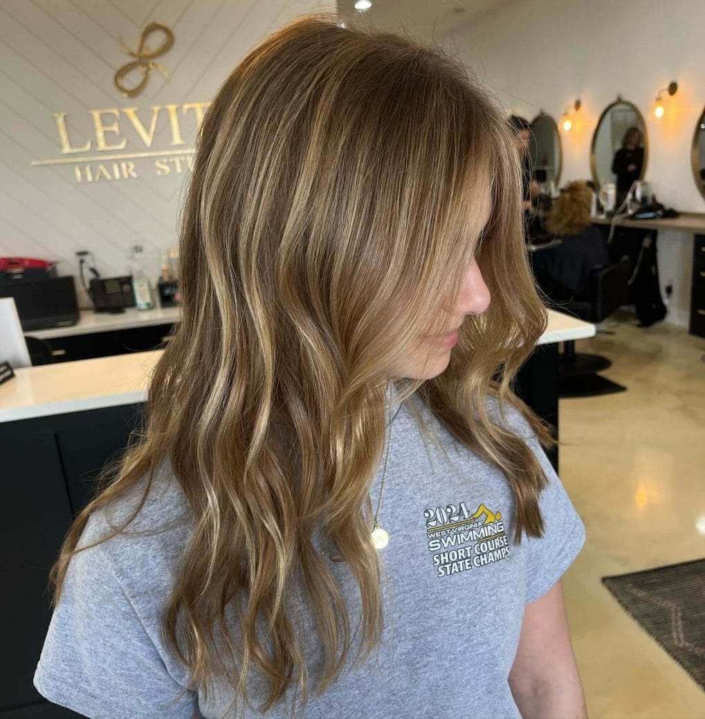 Medium-length soft waves with a side part for a relaxed school style