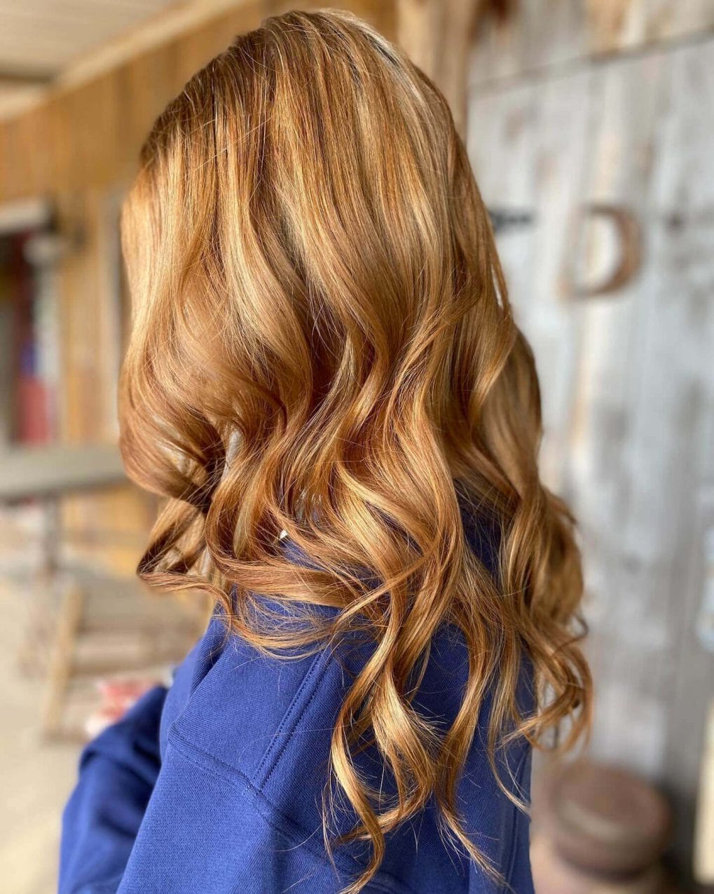 Long wavy hair with rich copper color and elegant waves for school